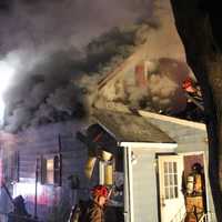 <p>An electrical fire sent flames through the attic and part of the home.</p>