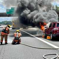 <p>MCFRS works to put out the vehicle fire on SB 270</p>