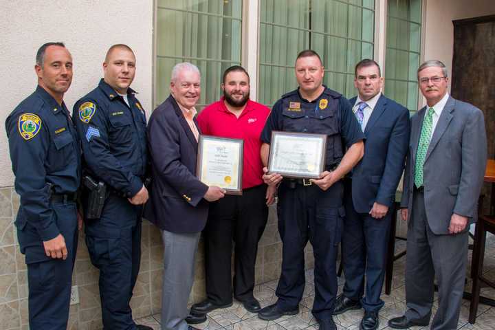 AAA Fairfield Branch Manager Mike Pamula, center, presented the awards to Lt. Bob Kalamaras, Sgt. Michael Paris, First Selectman Mike Tetreau, Officer Mark Letsch, Police Chief Gary MacNamara; and Deputy Chief Chris Lyddy.