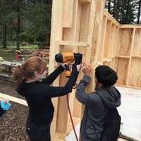 <p>Wooster School students built a shed for a solar water heater during a recent trip to The Farm at Holmes.</p>