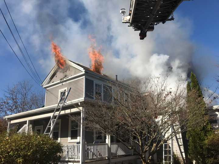 Smoke and flames coming from a home on Union Street in Natick