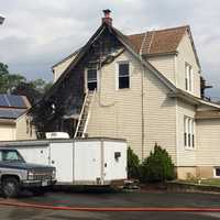 <p>An exterior fire spread to the attic of a Court Avenue home, authorities said.</p>