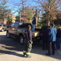 <p>Greenwich firefighters get Thanksgiving baskets ready for delivery.</p>