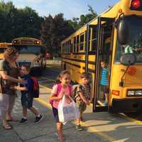 <p>Students exit buses on the first day of classes in the Lakeland Central School District.</p>