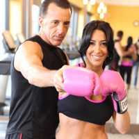 <p>Personal trainer and boxing instructor Rob Fletcher, left, works with a client. The Suffern man is suing actor Sylvester Stallone and NBC, claiming they stole his idea for a reality TV show.</p>