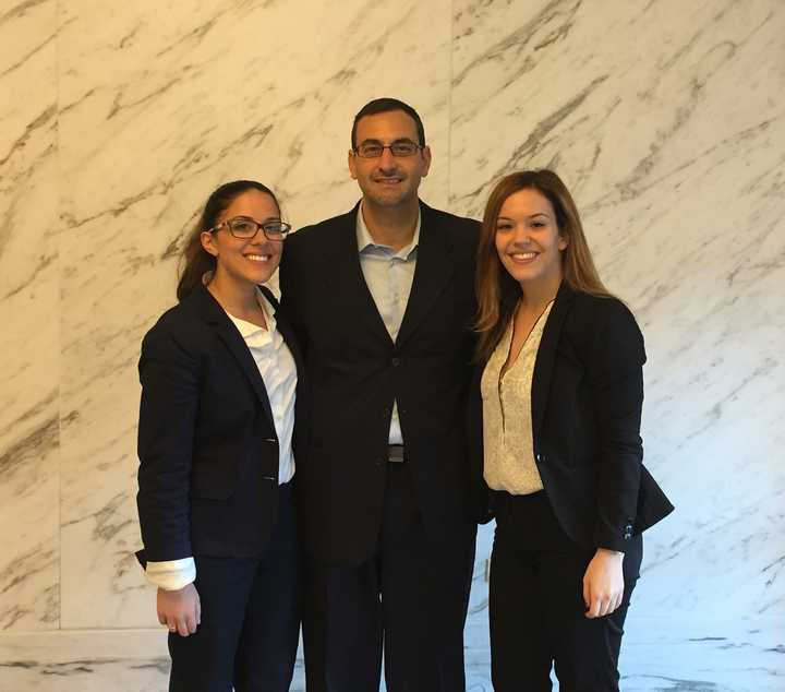 Prof. John Meringolo with Alexandra Corella and Samantha Osgood at the 2015 Judge Paul Kelly Invitational Trial Competition at Fordham.