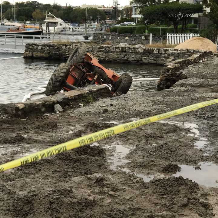 A forklift operator was a little wet, but unharmed after a seawall collapse sent the machine into the water.