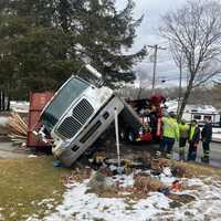 Auburn Road 'Impassable' Following Dump Truck Rollover Crash: Police
