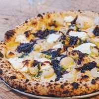 <p>Turnip pizza from Talula&#x27;s: Gruyere and ricotta cheese with turnips, greens and sea salt.</p>