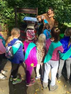 Scarlsdale Girl Scouts Press Apples, Earn Hiking Badges