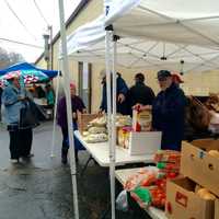 <p>Volunteers from the Black Rock Food Pantry braved chill rain to provide Thanksgiving turkeys and trimmings to 325 families the day before the holiday.</p>