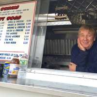 <p>Mark Butler waits in Mark&#x27;s Hot Dog truck in Bergenfield for his next customer.</p>