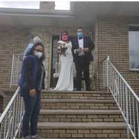 <p>The couple holding Cielo&#x27;s beautiful flower arrangements.</p>