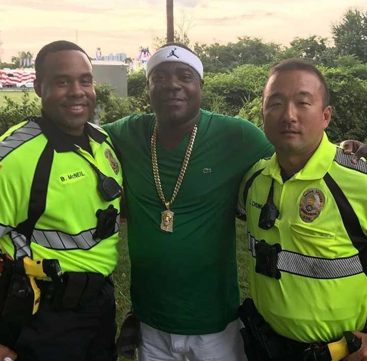 Tracy Morgan poses with Leonia Police Officers Brandon McNeil, left, and Sihoon Chung at the Leonia Sports Boosters carnival on Wednesday.