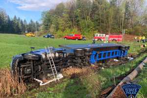 Tractor-Trailer Flips On Side After Rolling Off Mass Pike In Auburn: Police