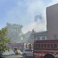 <p>Firefighters on scene of a large blaze in Jersey City.</p>