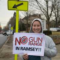 <p>Demonstrators stood on North Central Avenue in Ramsey to raise awareness about a pending gun range.</p>