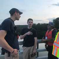 <p>Training members discuss water-safety drills.</p>