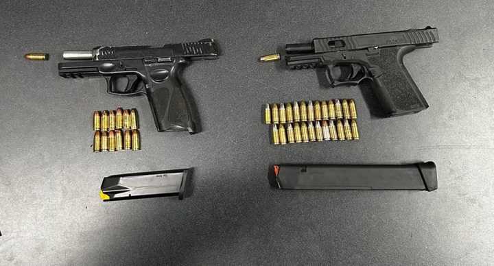 The firearms were recovered from the two teens in Baltimore.