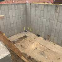 <p>The large foundation pit at a construction site located at 60 Shelter Rock Road in Searingtown.</p>