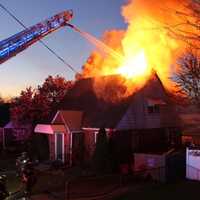 <p>Flames shot through the attic roof.</p>