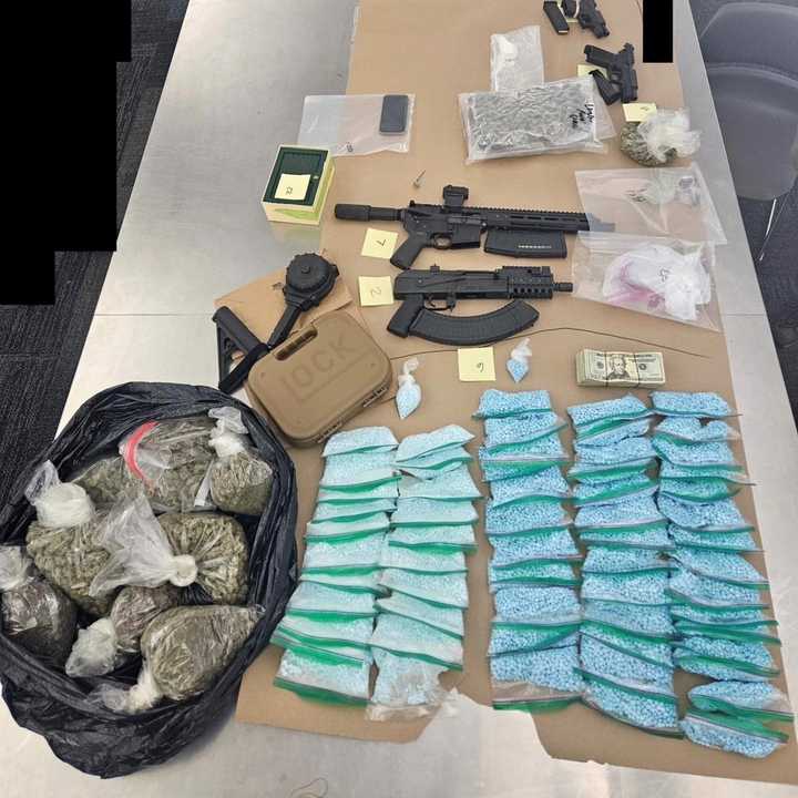 The seized drugs and weapons.