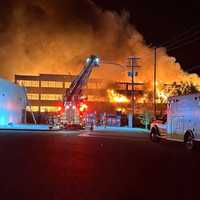 <p>Crews on the scene of the fire at&nbsp;Stewartstown Furniture Factory.</p>