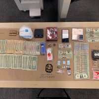 <p>Drugs and cash seized during the bust.</p>