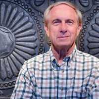 <p>I.M. Smitten Director George Holley stands before an artisan-crafted headboard in his Trumbull office/gallery.</p>