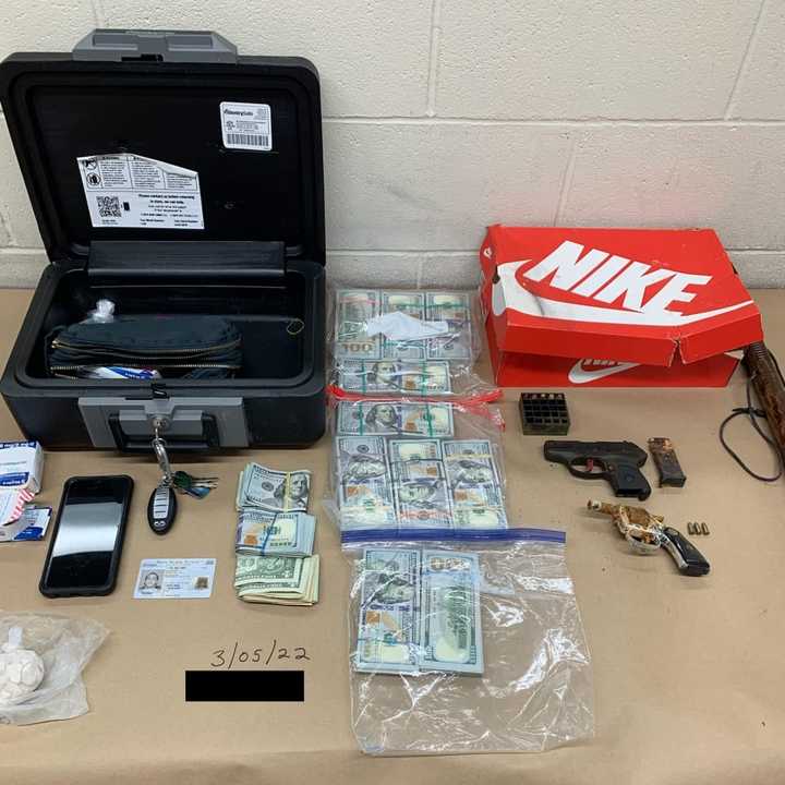 Suffolk County PD officers recovered two handguns, a Ruger LCP .380 and a Burgo .22-caliber short revolver, along with more than $100,000 in cash and a quantity of fentanyl and methadone, police said.