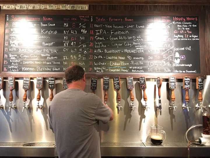 A bartender at Growler &amp; Gill draws some liquid gold from one of the Nanuet gastropub&#x27;s 24 taps.