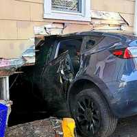 BAM! Tesla Plows Halfway Into New Milford Basement (w/PHOTOS)