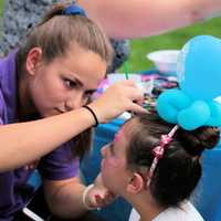 <p>Face painting and balloon hats were popular with the children.</p>