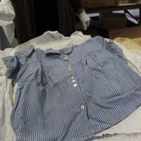 <p>A liberation blouse that was worn by displaced persons at the camps. The blouse was made for a grown woman, who weighed roughly 70 pounds at the time of liberation.</p>