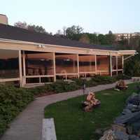 <p>A torch-lit path with benches at Half Moon in Dobbs Ferry.</p>