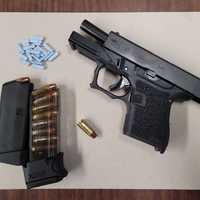 Man Charged After Handgun Found During Bedford Traffic Stop, Police Say