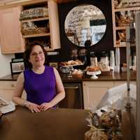 <p>Helene Godin, owner of By the Way Bakery, in her Hastings shop.</p>