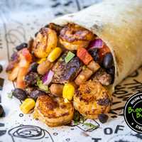 <p>A steak and shrimp burrito.</p>