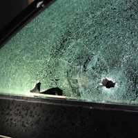 <p>Damage to one of the vehicles during the drive-by shooting.</p>