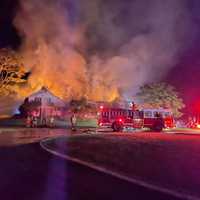 <p>Multiple fire crews worked to extinguish a large blaze that significantly damaged an unoccupied Stamford home.</p>