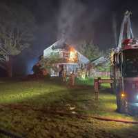 <p>Multiple fire crews worked to extinguish a large blaze that significantly damaged an unoccupied Stamford home.</p>