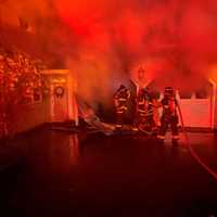 Fast-Moving Fire: 2 Cars Burn In Norwalk, House Saved