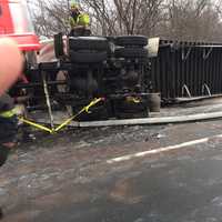 <p>A stretch of I-84 in Dutchess remains closed around noontime following an early morning rollover collision involving a tractor-trailer Tuesday.</p>