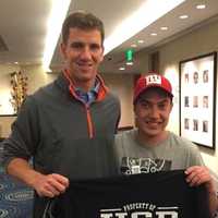 <p>Eli and Special Olympian John Manning (no relation)</p>