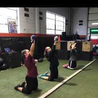 <p>Members of the Lyndhurst High School shotput team develop their skills.</p>