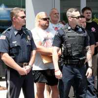 <p>Pink Heals President John LaFalce, at right, with responders.</p>