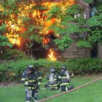 <p>Firefighters on the scene of the house fire at Barrett Place on Tuesday night.</p>