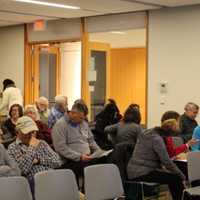 <p>The audience fills in the Main Program Room at Ridgefield Library and reviews handouts prior to a talk on Hiking in Fairfield County by Jeff Glans.</p>