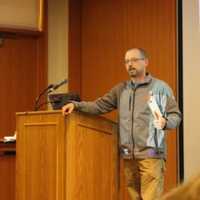 <p>Michael Rubbo, executive director of the Woodcock Nature Center in Wilton, introduces Jeff Glans, the speaker for a talk, Hiking in Fairfield County, at the Ridgefield Library.</p>