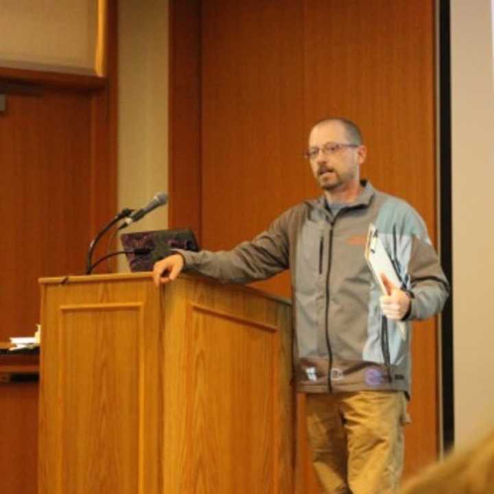 Michael Rubbo, executive director of the Woodcock Nature Center in Wilton, introduces Jeff Glans, the speaker for a talk, Hiking in Fairfield County, at the Ridgefield Library.